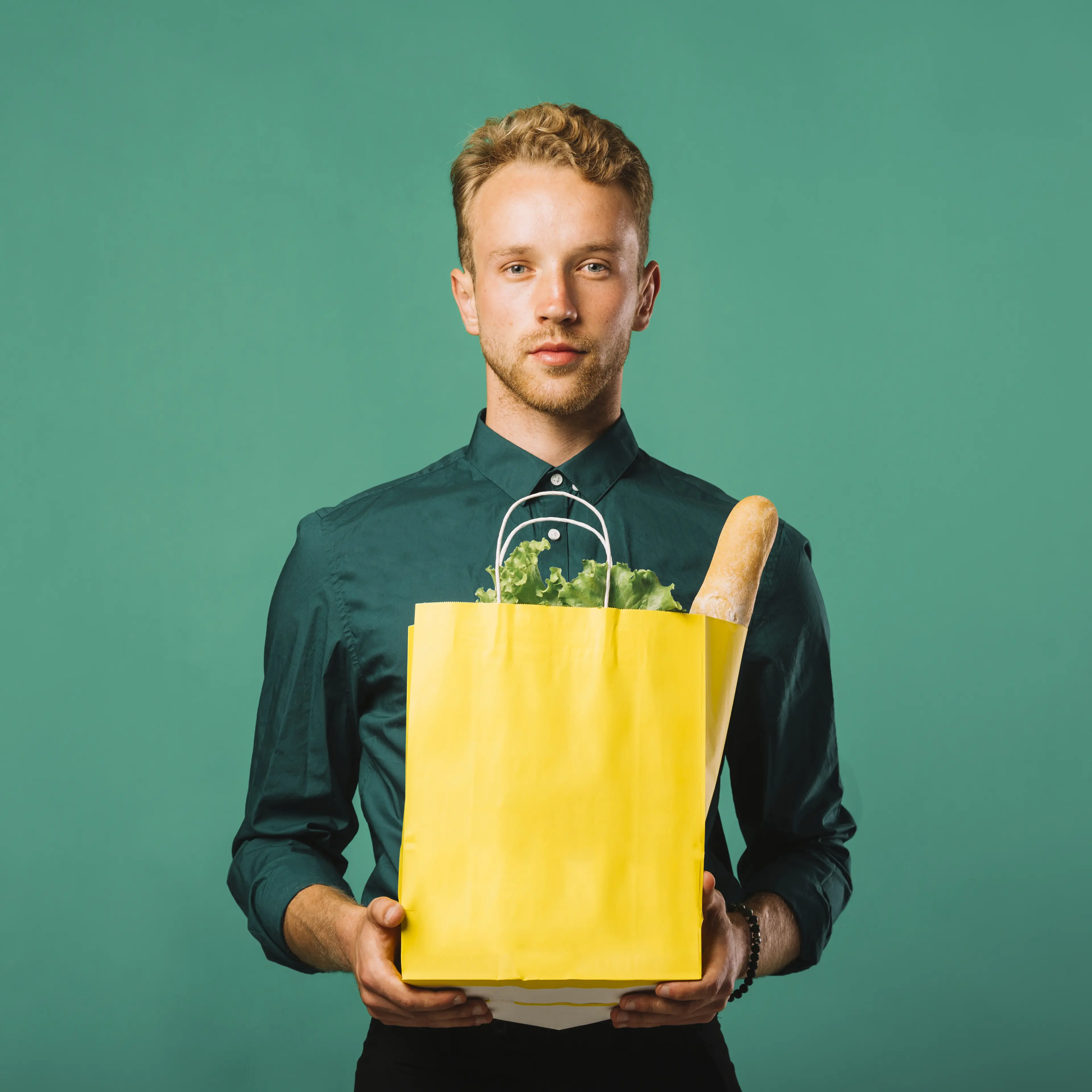 front-view-pretty-man-holding-groceries-bag